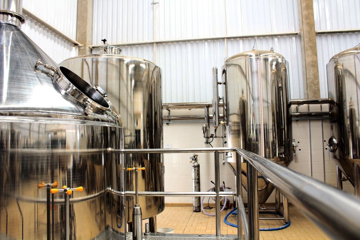 Stainless-steel cleaning-in-place tanks in a processing plant.